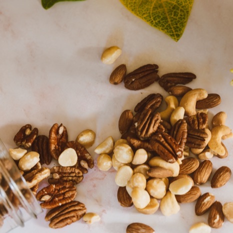 A mix of pecans, almonds, cashews, and macadamia nuts