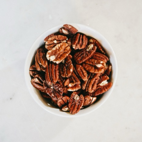 A bowl of shelled pecan halves